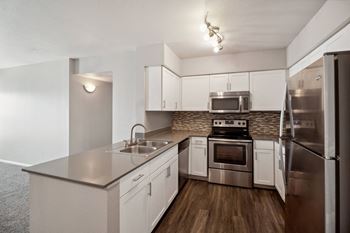 spacious kitchen with stainless steel appliances at Dakota Ridge apartments